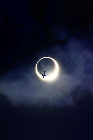 60688-Plane-Over-Eclipse